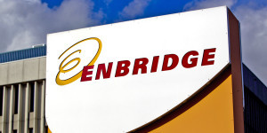 Enbridge Inc. signage is displayed outside of the company's corporate office in Toronto, Ontario, Canada, on Friday, Oct. 28, 2011. Enbridge Inc. provides energy transportation, distribution, operates crude oil and liquids pipeline systems, natural gas transmission for midstream businesses in North America and internationally. Photographer: Brent Lewin/Bloomberg via Getty Images