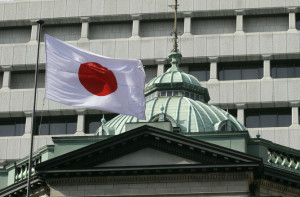 epa03613196 A Japanese national flag is flapping at the Bank of Japan (BOJ) in Tokyo, Japan, 07 March 2013. Japan's central bank on 07 March said it would pursue its policy of aggressive monetary easing and near-zero base interest rates as the economy showed signs of improvement. The announcement came as bank Governor Masaaki Shirakawa was to step down 19 March along with two deputies and be replaced by Haruhika Kuroda, former president of the Asian Development Bank and a long-standing advocate of aggressive monetary easing.  EPA/KIMIMASA MAYAMA