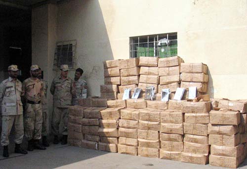 KARACHI, PAKISTAN, NOV 15: Anti-Narcotics Force (ANF) officers show seized boxes of 
Hashish during press conference at ANF headquarter in Karachi on Tuesday, November 15, 2011. (Rizwan Ali/PPI Images).