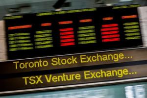 A sign board displaying Toronto Stock Exchange (TSX) stock information is seen in Toronto June 23, 2014. REUTERS/Mark Blinch