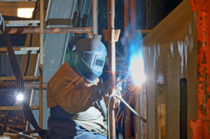 a welder working at shipyard in day time