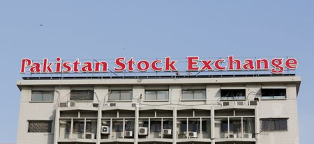 A sign of the Pakistan Stock Exchange is seen on its building in Karachi, Pakistan January 11, 2016. REUTERS/Akhtar Soomro/File Photo