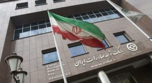 An Iranian flag flutters in front of the head office of the Export Development Bank of Iran (EDBI) in Tehran November 9, 2008. REUTERS/Morteza Nikoubazl (IRAN) - RTXAEWW