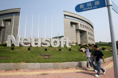 ** ADV FOR WEEKEND NOV. 17-18 ** Chinese youths walk past the Neusoft campus, a privately run school nurturing computer technology students along a road aptly named Shuma Lu or Digital road in Dalian, northeastern China's Liaoning province on Sept. 10, 2007. In the last decade, Hewlett-Packard Co., IBM Corp., Britain's BT Group PLC and some 230 other foreign companies have flocked to Dalian to set up business software and outsourcing facilities, creating a new center for a multibillion-dollar global industry. (AP Photo/CHINATOPIX) ** CHINA OUT **