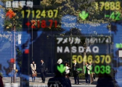 People are reflected in a display showing the Nikkei average (top in L) and the NASDAQ average of the U.S outside a brokerage in Tokyo, Japan, November 7, 2016. REUTERS/Kim Kyung-Hoon