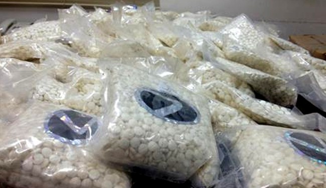 A large quantity of Captagon tablets are displayed at a police station in Beirut on Tuesday, August 13, 2013. (Source: The Daily Star)