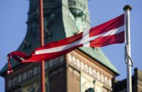 A Danish flag flies in central Copenhagen, Denmark on Friday, Nov. 20, 2009. DenmarkÕs unemployment rate rose in October to the highest in three and a half years as companies adjusted to smaller export markets by cutting jobs. Photographer: Chris Ratcliffe/Bloomberg