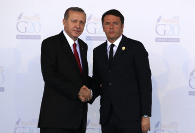 Turkish President Recep Tayyip Erdogan, left, welcomes Italian Premier Matteo Renzi, at the G-20 summit in Antalya, Turkey, Sunday, Nov. 15, 2015. The 2015 G-20 Leaders Summit is held near the Turkish Mediterranean coastal city of Antalya on Nov. 15-16, 2015. (AP Photo/Lefteris Pitarakis)