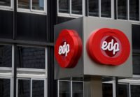 FILE PHOTO: The logo of Portuguese utility company EDP - Energias de Portugal is seen at the company's offices in Oviedo, Spain, May 14, 2018.  REUTERS/Eloy Alonso