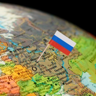 Map with miniature Flag of Russia. Selective focus on Russian Flag in Moscow