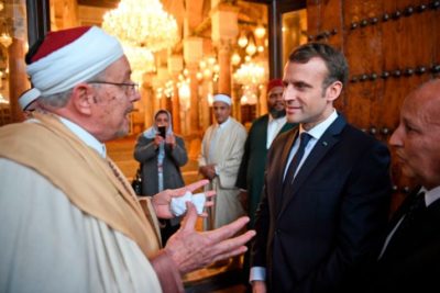 French President Emmanuel Macron (C-R) speaks with a Muslim cleric as he visits the Zitouna mosque in the Medina (old town) of the Tunisian capital Tunis on February 1, 2018, during his first state visit to the North African country. / AFP PHOTO / POOL / Eric FEFERBERG        (Photo credit should read ERIC FEFERBERG/AFP/Getty Images)