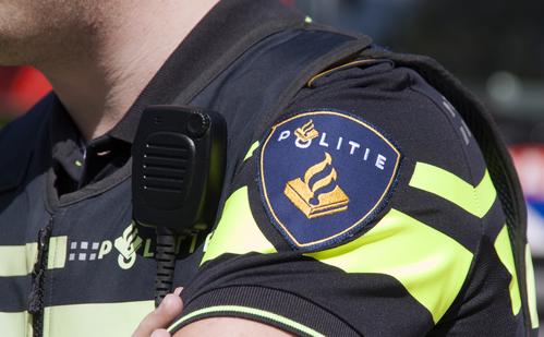 Amsterdam,netherlands-may 17, 2015:  Dutch police badge and radio walkie talkie