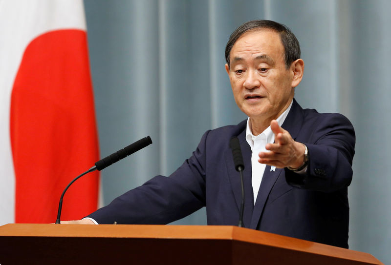 FILE PHOTO: Japan's Chief Cabinet Secretary Yoshihide Suga attends a news conference at Prime Minister Shinzo Abe's official residence in Tokyo, Japan May 29, 2017.   REUTERS/Toru Hanai