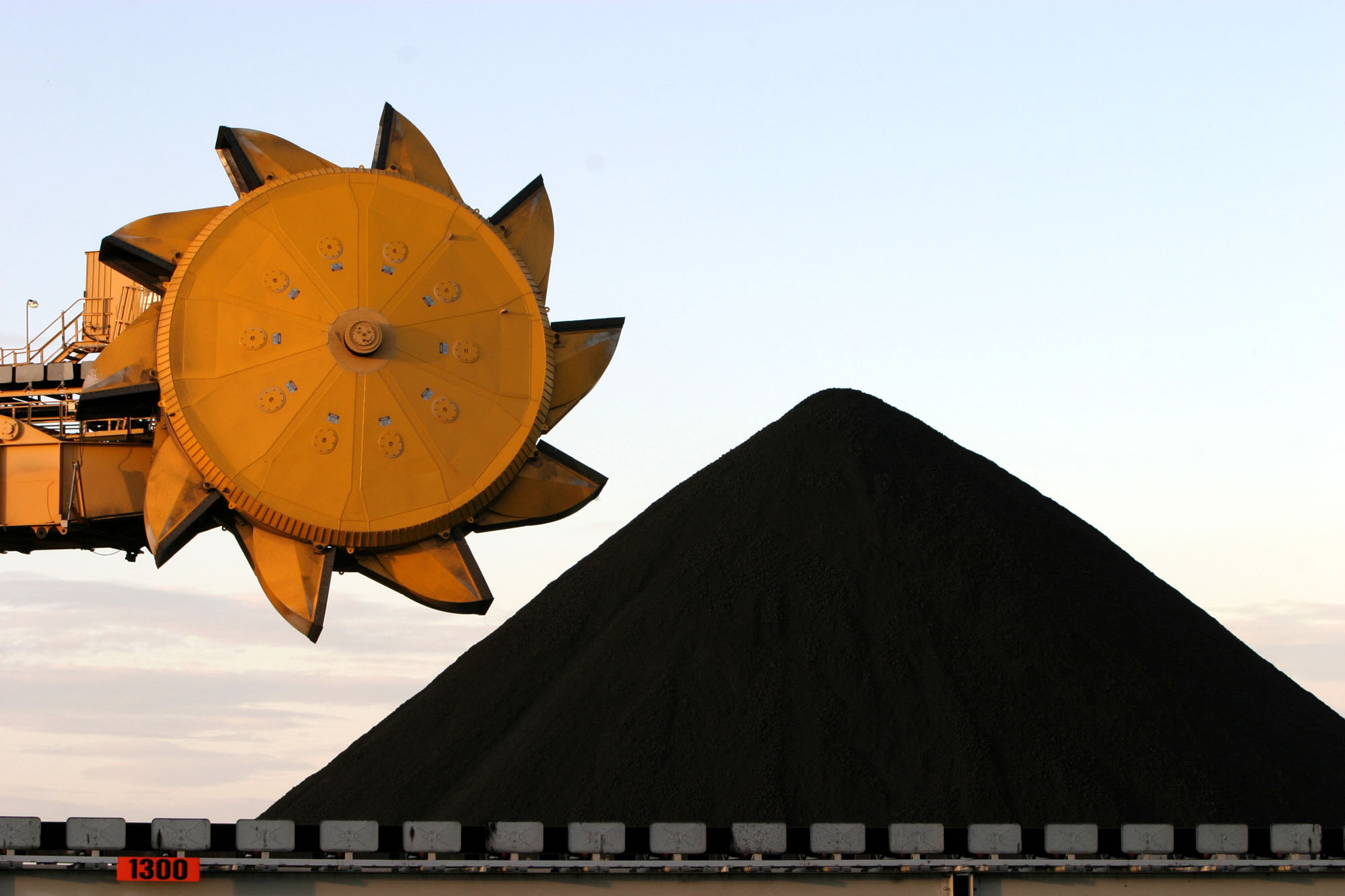 A bucketwheel coal reclaimer stands ready near  a pile of coal at the port in Newcastle on April 1, 2004.