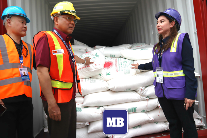 Customs Commissioner Rey Leonardo B. Guerrero (middle), Subic District Collector Maritess Martin (right) and a customs official present to the media the container full of smuggled Thailand refined sugar at the New Container Terminal 1 in Subic Bay Freeport on Friday. (Jonas Reyes)