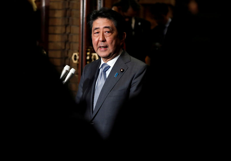 FILE PHOTO : Japan's Prime Minister Shinzo Abe speaks to media after phone talks with U.S. President Donald Trump (not pictured) after second North Korea-U.S. summit, at Abe's residence in Tokyo, Japan February 28, 2019. REUTERS/Issei Kato