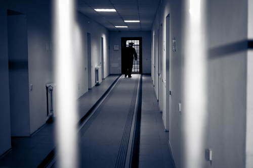 Corridor prison. Picture was taken in a dark key, to emphasize the bleakness of the environment
