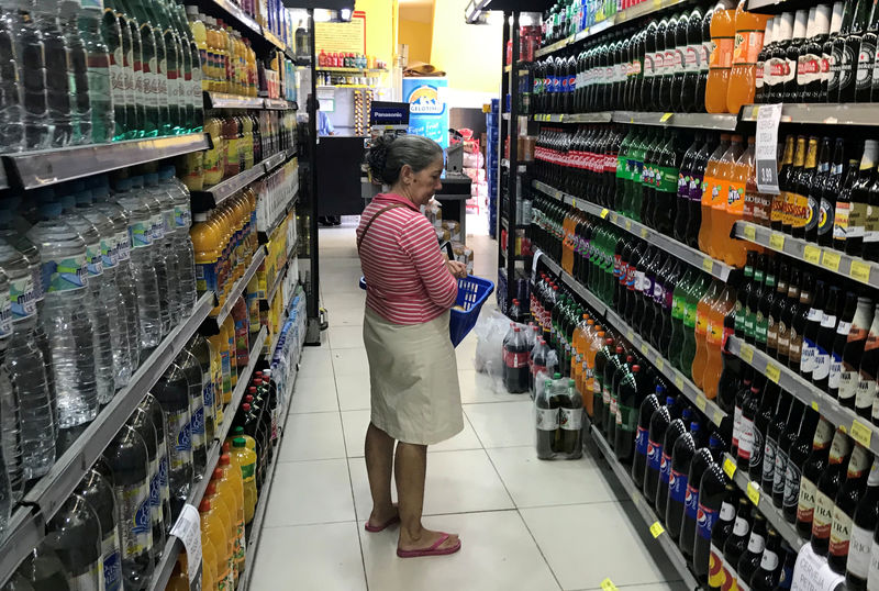 FILE PHOTO: A costumer looks for drinks at a supermarket in Rio de Janeiro, Brazil May 10, 2019. REUTERS/Pilar Olivares/File Photo