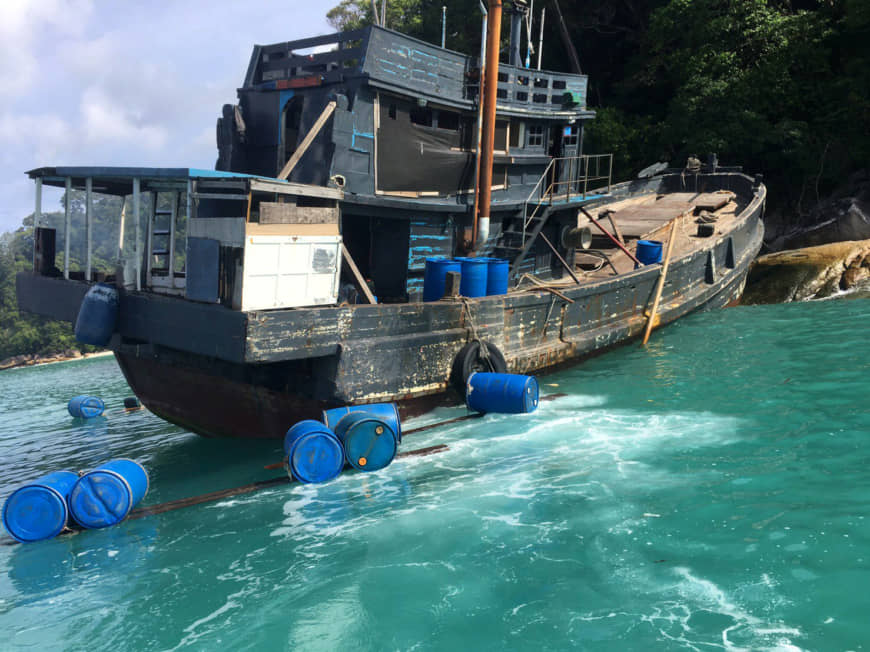A fishing boat which according to officials was smuggling Rohingya refugees is seen stranded at Rawi island, part of Tarutao national park in the province of Satun, Thailand, bordering with Malaysia, June 11, 2019. Department of National Parks Wildlife and Plant Conservation/Handout via REUTERS THIS IMAGE HAS BEEN SUPPLIED BY A THIRD PARTY. NO RESALES. NO ARCHIVES