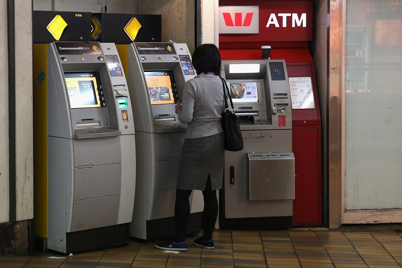 SYDNEY, NEW SOUTH WALES - APRIL 07:  A woman uses a Commonwealth bank ATM on April 7, 2016 in Sydney, Australia. Prime Minister Malcolm Turnbull on Wednesday reprimanded the banking industry for its treatment of customers and recent financial advice scandalls  (Photo by Cameron Spencer/Getty Images)