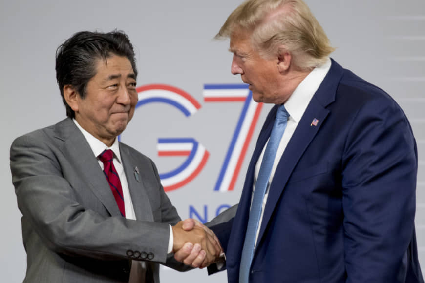 U.S President Donald Trump and Japanese Prime Minister Shinzo Abe, left, shake hands following a news conference at the G-7 summit in Biarritz, France, Sunday, Aug. 25, 2019, to announce that the U.S. and Japan have agreed in principle on a new trade agreement. (AP Photo/Andrew Harnik)