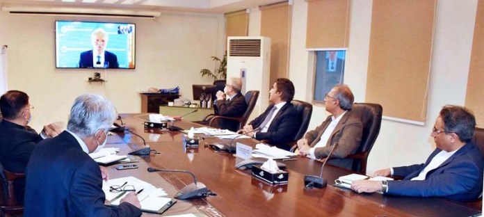 APP80-22
ISLAMABAD: October 22 - Adviser to the Prime Minister on Finance, Dr. Abdul Hafeez Shaikh in a virtual meeting with Managing Director World Bank, Mr. Axel Van Trotsenburg and Vice President SAR, World Bank, Mr. Hartwing Schafer. APP