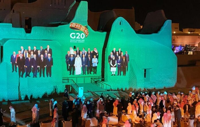 "Family Photo" for annual G20 Summit World Leaders is projected onto Salwa Palace in At-Turaif, one of Saudi Arabia?s UNESCO World Heritage sites, in Diriyah, Saudi Arabia, November 20, 2020. REUTERS/Nael Shyoukhi