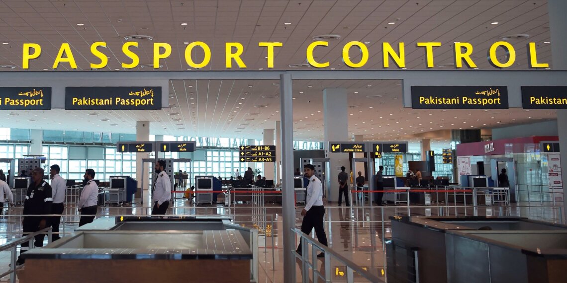 In this photograph taken on April 26, 2018, Pakistani airport staff walk through the new Islamabad International Airport ahead of its official opening on the outskirts of Islamabad.
Pakistani Prime Minister Shahid Khaqan Abbasi has officially openend Islamabad's new international airport. / AFP PHOTO / AAMIR QURESHI