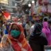 Women shop at a market after the government eased the lockdown imposed as a preventive measure against the COVID-19 coronavirus, in Rawalpindi on May 9, 2020. (Photo by Farooq NAEEM / AFP)
