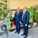 Federal Minister for Commerce Jam Kamal Khan and Belarusian Energy Minister Alexey Kushnarenko stand beside a handcrafted Pakistani rickshaw at the Pakistan-Belarus Business Forum 2024 in Islamabad, discussing its intricate design and cultural significance in Islamabad on November 25, 2024.