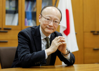 FILE PHOTO: Japan's vice minister of finance for international affairs, Masato Kanda, poses for a photograph during an interview with Reuters at the Finance Ministry in Tokyo, Japan January 31, 2022. Picture taken January 31, 2022. REUTERS/Issei Kato