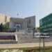 The Supreme Court of Pakistan building in Islamabad, Pakistan, on Tuesday, April 5, 2022. To avoid losing a no-confidence vote in parliament, Pakistan leader Imran Khan instead triggered an unprecedented political crisis. Now the question is whether voters will reward him at the next election. Photographer: Asad Zaidi/Bloomberg via Getty Images